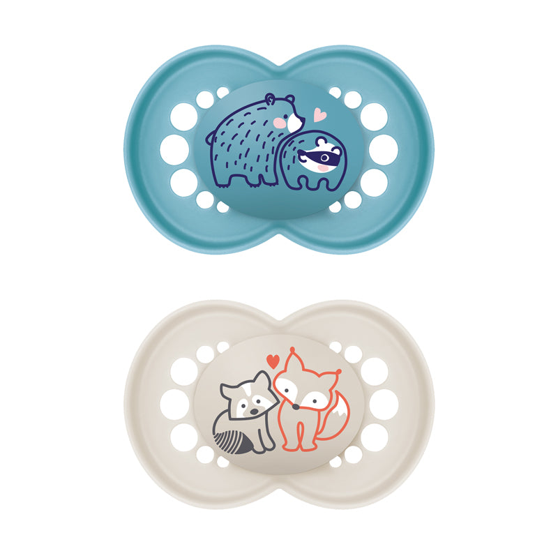 Two baby pacifiers with animal illustrations on a white background