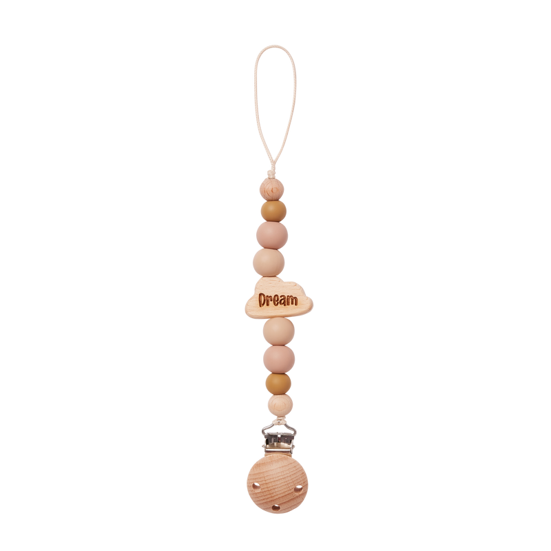 Wooden pacifier clip with beads in beige and 'Dream' charm on a white background