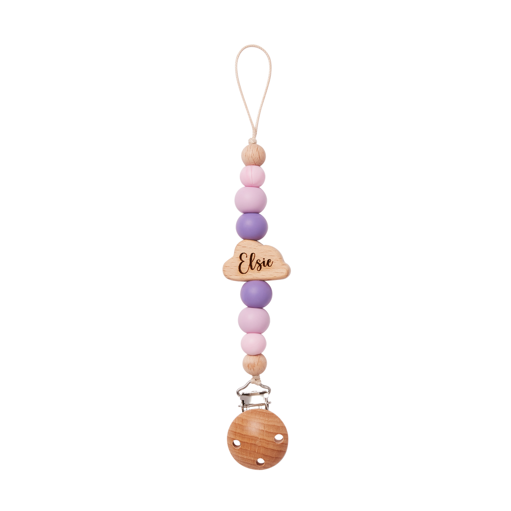 Colorful beaded pacifier clip in purple with a wooden tag engraved 'Elise' on a white background