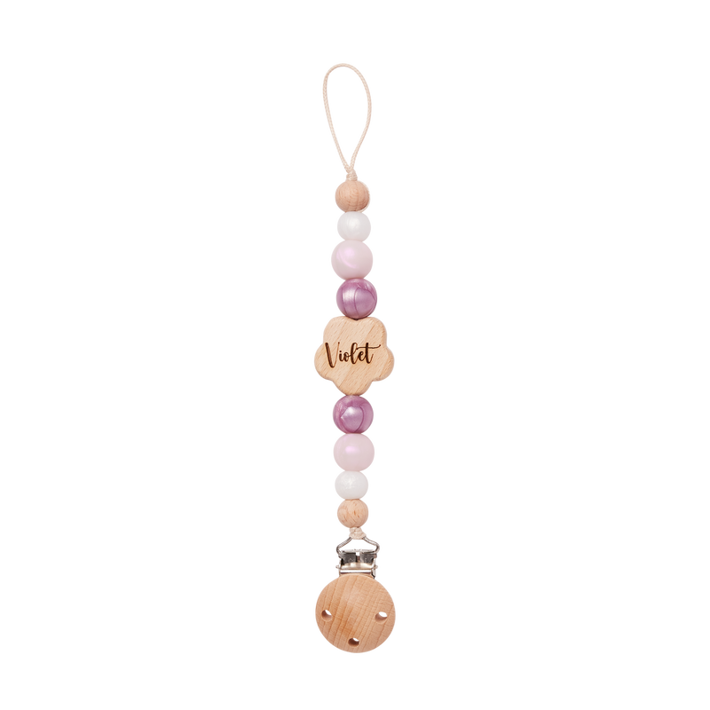 Beaded pacifier clip with wooden heart charm and 'Violet' engraving on a white background