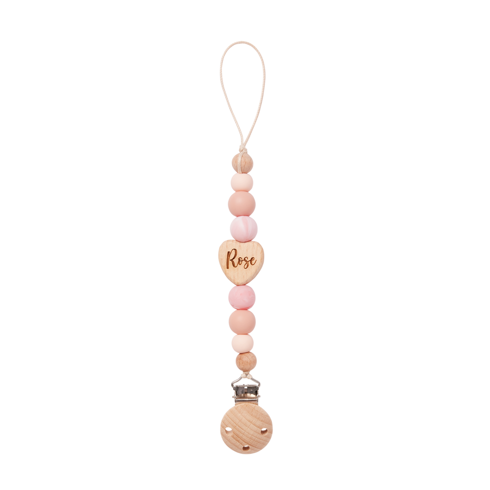 Pacifier Clip with heart-shaped tag and 'Rose' engraving on a white background
