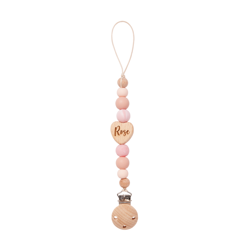 Pacifier Clip with heart-shaped tag and 'Rose' engraving on a white background