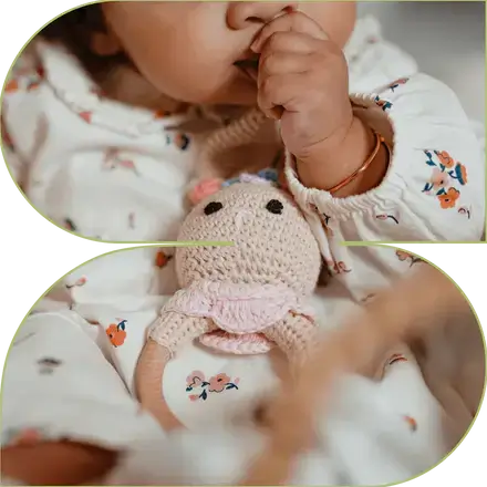 Baby using bunny crochet rattle toy