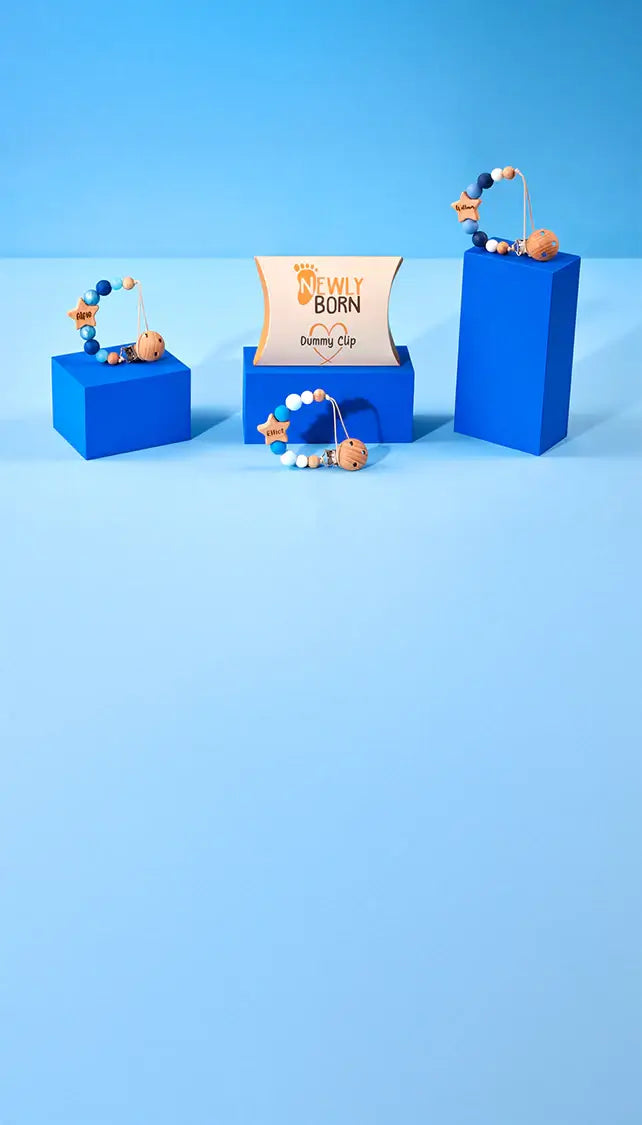 Personalised Star Dummy Clip on blue plinth background by Newly Born 